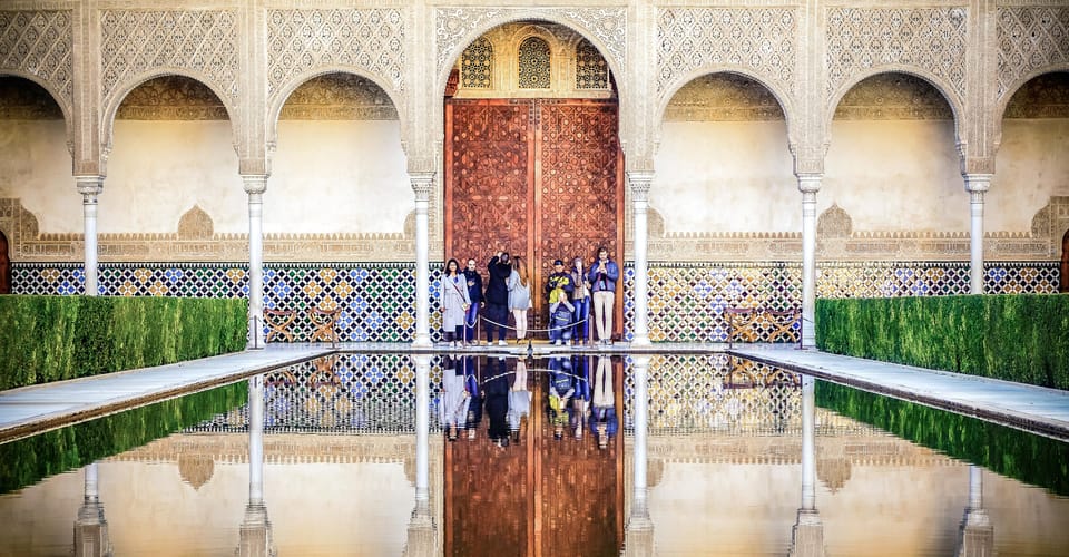 Granada: Alhambra & Nasrid Palaces Small Group Guided Tour - Meeting Point and Timing: start time shifts in high season